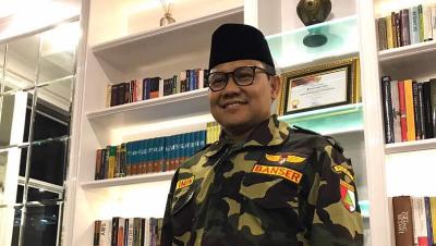 Ketum PKB Muhaimin Iskandar berpakaian Banser. [Foto: Repro]