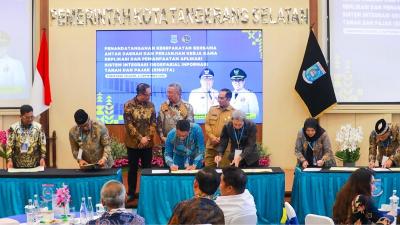 Penandatangan nota kesepahaman dan perjanjian kerja sama replikasi Sistem Integrasi Geospasial Informasi Tanah dan Pajak (SISGITA). - Foto: Dok Pemkot Tangsel -